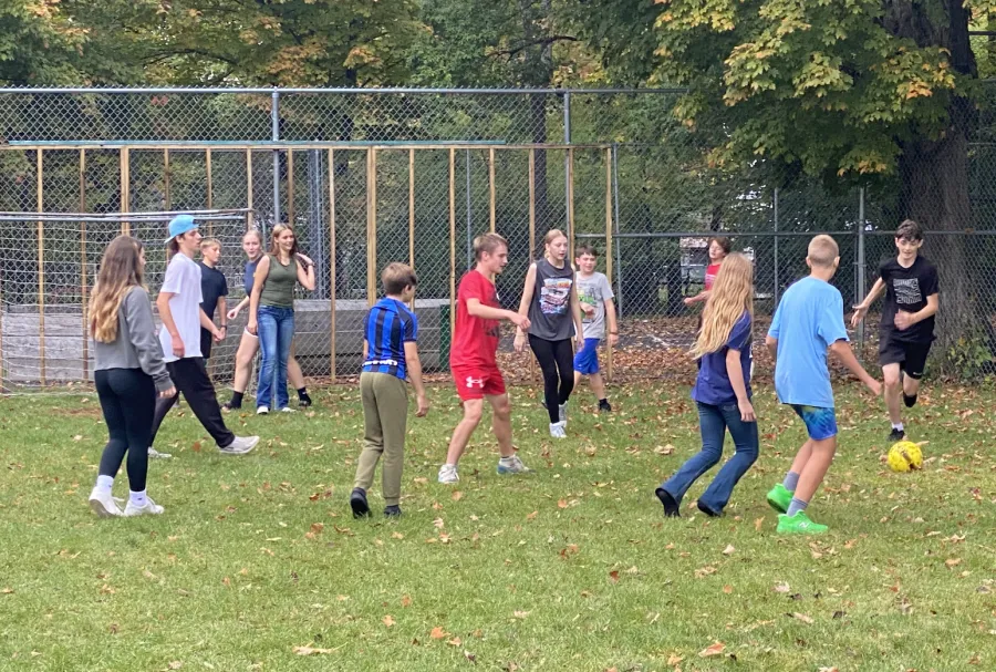 teens playing soccer